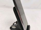 a cell phone that is sitting on a stand