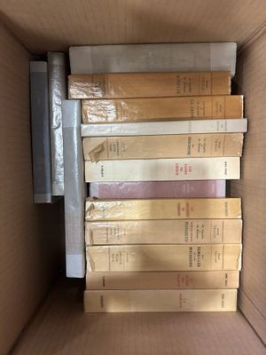 a lot of books in a box on the table