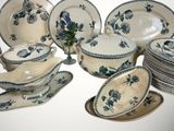a lot of plates and bowls that are sitting on a table