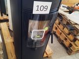 an image of a large black stove in a warehouse