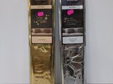 two packages of chocolates sitting next to each other on a table