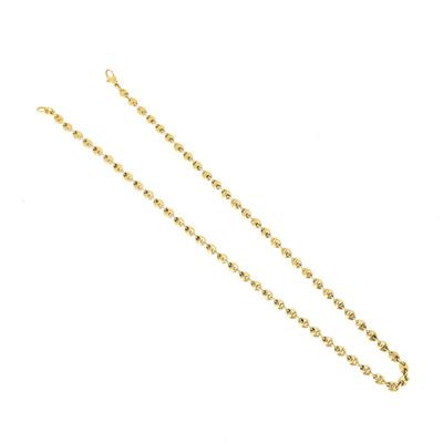 a close up of a gold chain on a white background