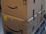 a stack of boxes sitting on a pallet in a warehouse