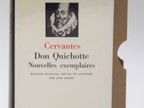 an open book with a picture of a woman in a dress