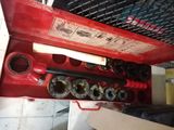 a red box with a bunch of tools inside of it
