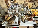 many different types of figurines displayed on the table