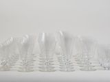 a lot of empty wine glasses sitting on a table