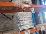 a large rack with many items on it in a warehouse