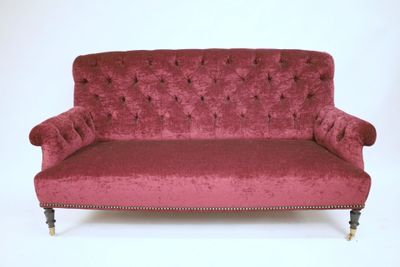an image of a red couch against a white background