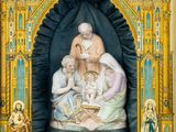 an image of a statue of a woman holding a baby in a church
