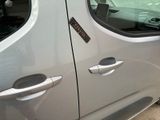 a silver car that has a sticker on the side of it