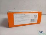 an orange box with a white label on it sitting on a table