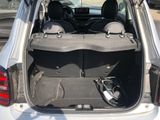 a trunk of a car that has a bunch of luggage in it