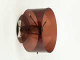 a lamp that is hanging on the wall next to a wall