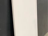 a white door leaning against a wall in a room