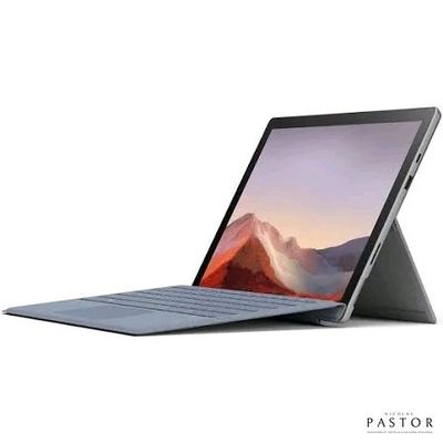 Un ordinateur portable Microsoft Surface et un Surface Book exposés sur un fond blanc