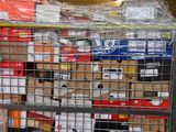 a metal cart with many boxes on top of it