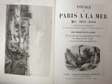 an open book with a drawing of a city in it