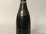 a bottle of wine that is sitting on a table