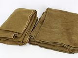 three brown blankets folded on top of each other