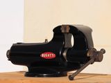 a black machine that is sitting on a wooden table