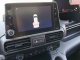 a picture of a car dashboard with a cell phone in it
