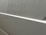 a white car with writing on the side of it