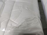 two mattresses that have been wrapped up in plastic