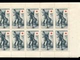 a stamp with a picture of a man and a dog on it