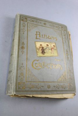 a close up of a book on a table with a white background