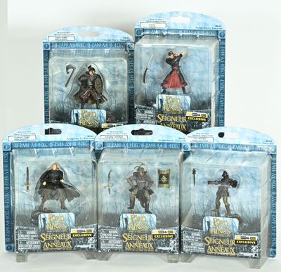 six action figures of the lord of the rings in a display case
