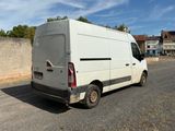 a white van that is parked on the side of the road