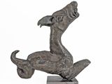 statue of a dog on a skateboard on a white background