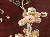 a wooden box with a painting of a tree and birds on it