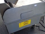 a machine that is sitting on the ground in the parking lot