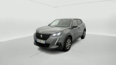 a grey car in a white room with a white background