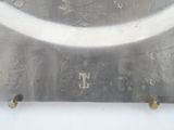 a silver clock with roman numerals and roman numerals on it