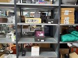 many shelves with various items on them in a room