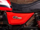 a close up of a red motorcycle with a black seat