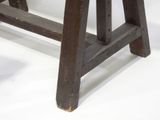 a small wooden bench with a wooden seat on a white surface