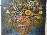 a painting of a vase filled with flowers on top of a table