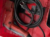 an image of a red tool box with tools in it