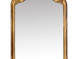 an image of a gold framed mirror on a white background