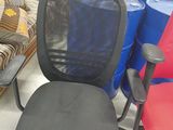 a chair that is sitting next to a couch in a room