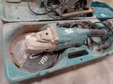 two tools in a case that are sitting on the floor