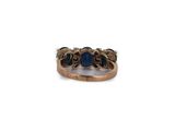 an image of a gold ring with blue stones on it