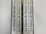three books are stacked on top of each other on a table