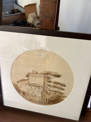 une photo d'une photo représentant une maison, dans un cadre