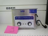 an image of a laboratory machine with a note on the counter