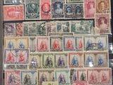 a picture of a collection of stamps on display in a glass case
